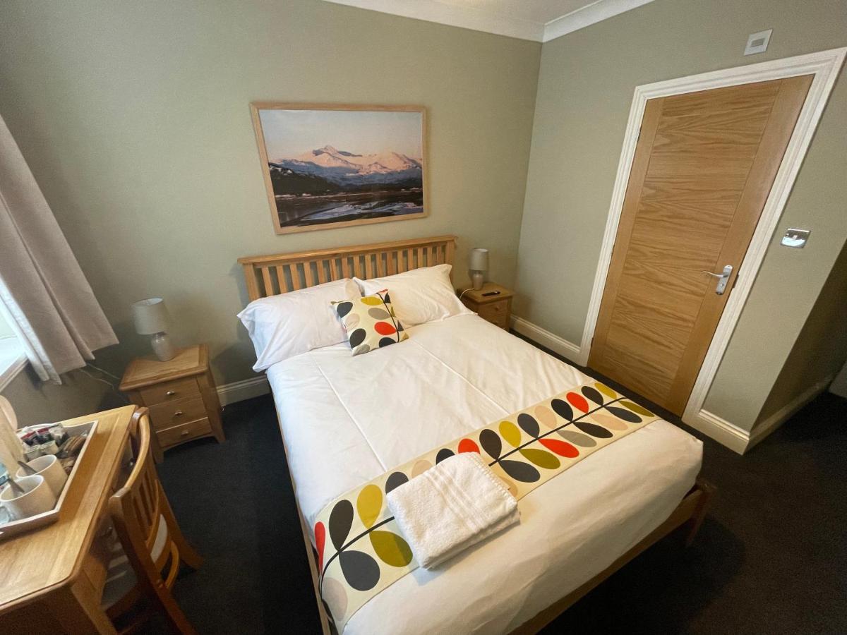 A made-up double bed upstairs