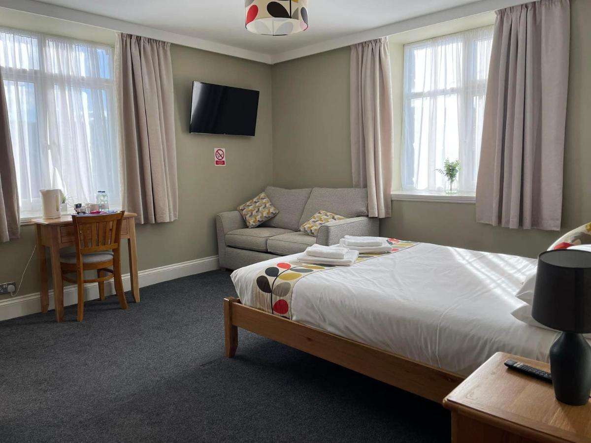 The family room: double bed and sofa bed by two windows